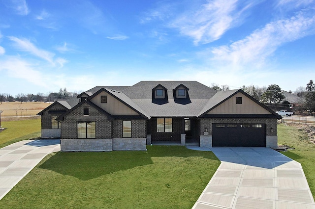 modern farmhouse with brick siding, a garage, concrete driveway, and a front yard