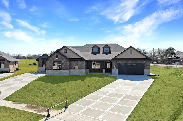 view of front facade featuring a front yard, an attached garage, brick siding, and driveway