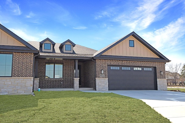 view of front of property with a front lawn, a garage, brick siding, and board and batten siding