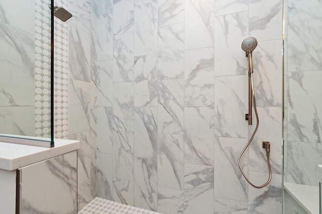 bathroom with a tile shower