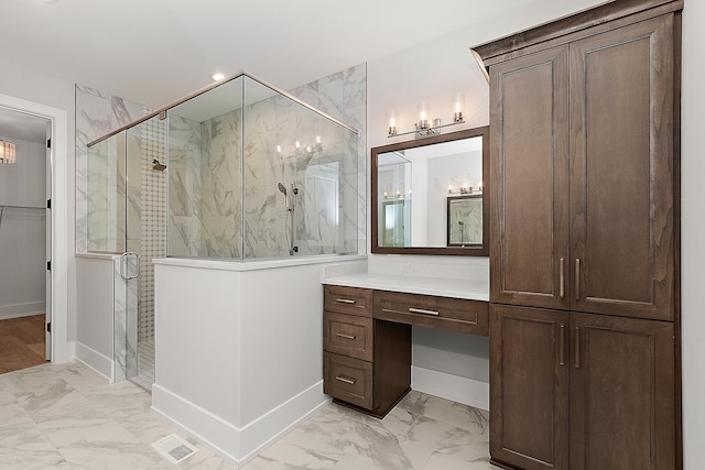 bathroom with a marble finish shower, visible vents, baseboards, marble finish floor, and vanity