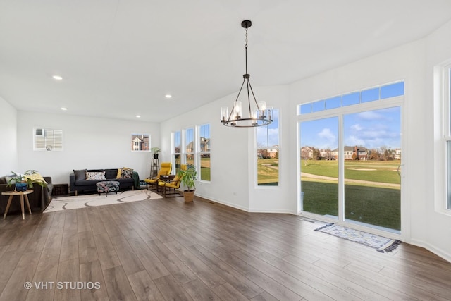 dining room featuring hardwood / wood-style flooring and a notable chandelier