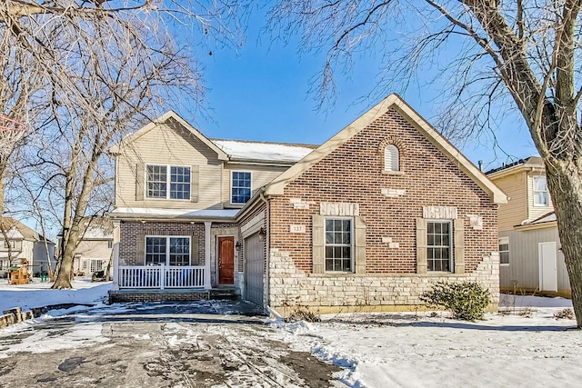 front of property with a garage and covered porch