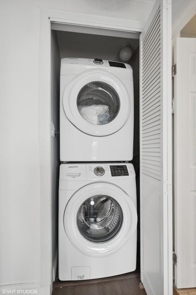 laundry room with stacked washer / drying machine