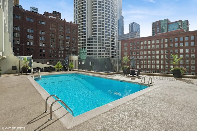 view of pool featuring a patio