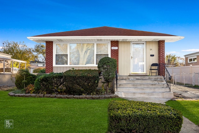 bungalow with a front yard