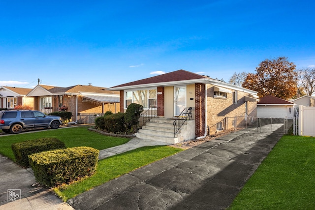 bungalow-style house featuring a garage and a front lawn