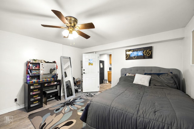 bedroom featuring hardwood / wood-style flooring and ceiling fan