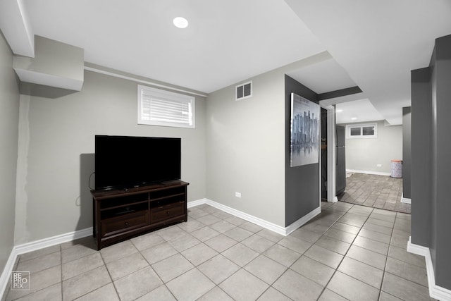 living room with light tile patterned flooring