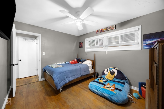 bedroom featuring hardwood / wood-style flooring and ceiling fan