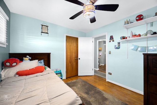 bedroom featuring wood-type flooring and ceiling fan