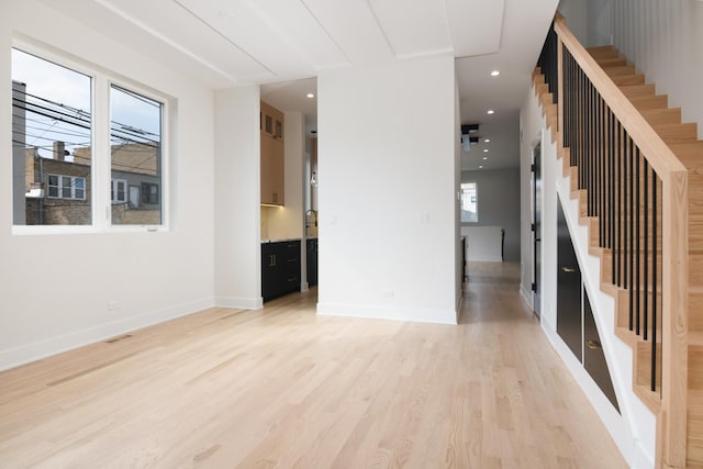 empty room with light hardwood / wood-style floors