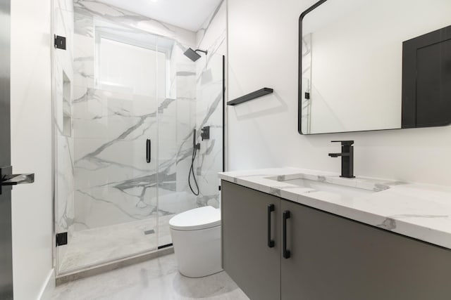 bathroom featuring vanity, toilet, and walk in shower