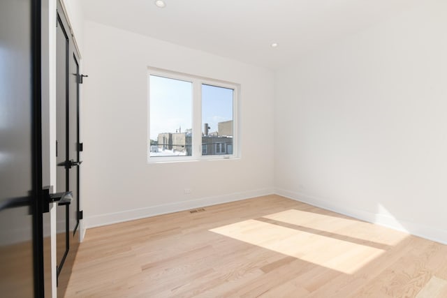 empty room with light wood-type flooring