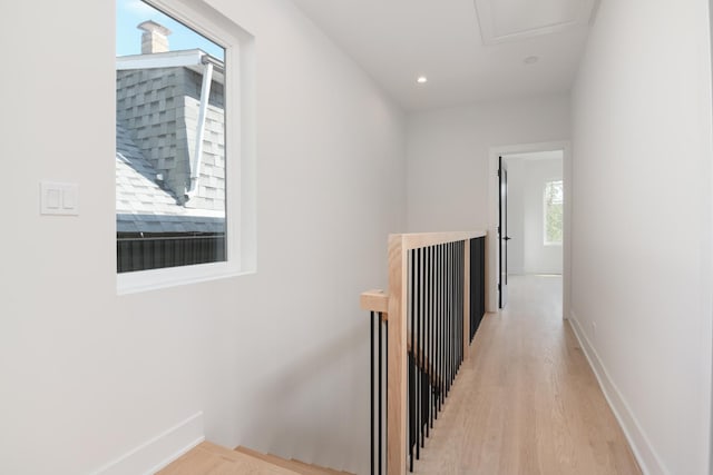 corridor with light wood-type flooring