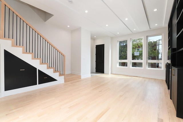 unfurnished living room with light hardwood / wood-style floors