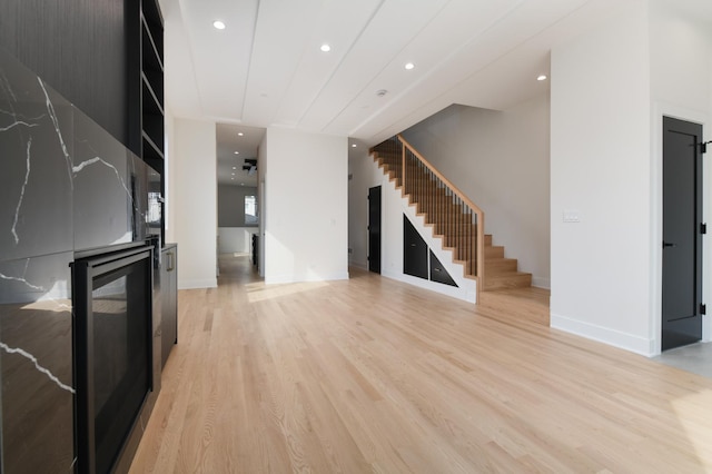 unfurnished living room with light hardwood / wood-style floors