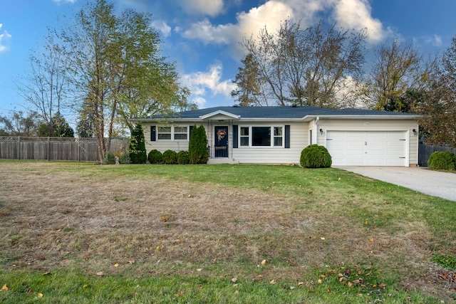 ranch-style home featuring a garage and a front lawn