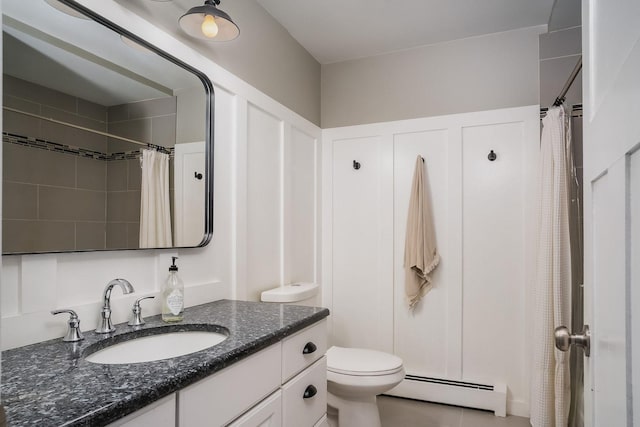 bathroom with toilet, vanity, a shower with shower curtain, and a baseboard heating unit