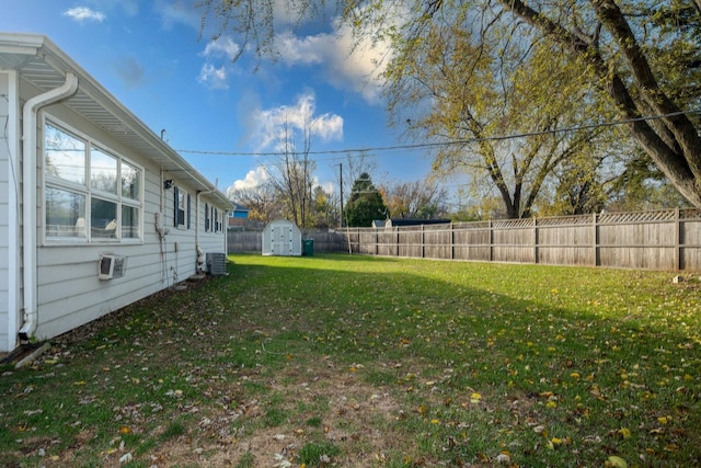 view of yard featuring a storage unit and cooling unit