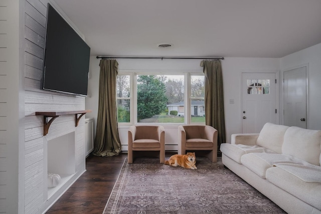 living room with dark hardwood / wood-style flooring