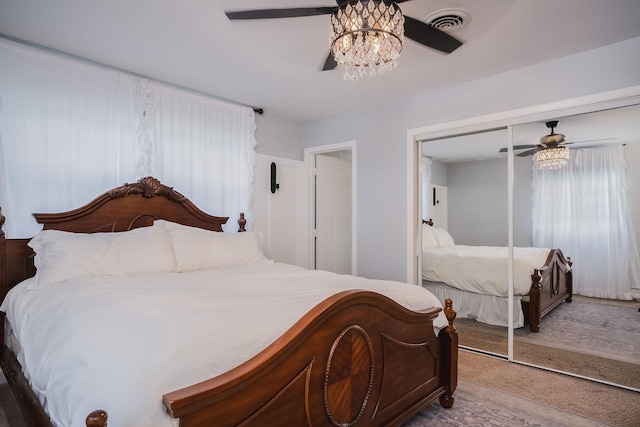 bedroom featuring ceiling fan and a closet