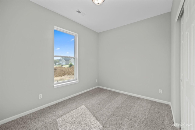 empty room with carpet flooring