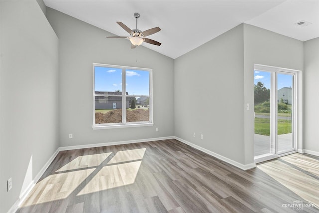 empty room with light wood-type flooring, vaulted ceiling, and ceiling fan