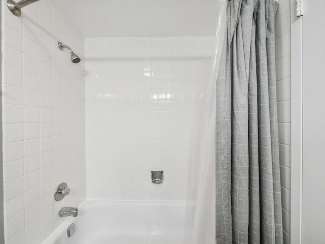 bathroom with shower / tub combo with curtain