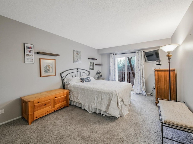 bedroom featuring carpet, a textured ceiling, and access to exterior