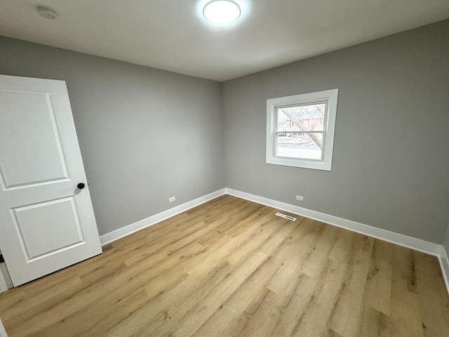 unfurnished room featuring light hardwood / wood-style flooring