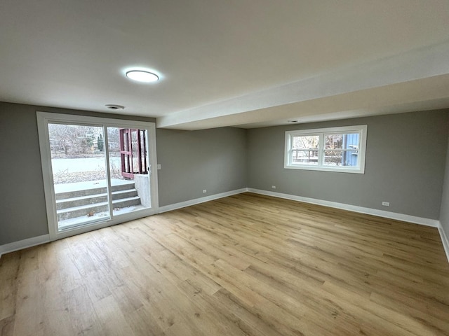 spare room featuring light hardwood / wood-style flooring