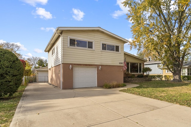 front of property featuring a garage and a front yard