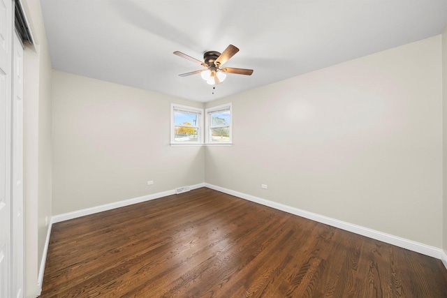 unfurnished room featuring ceiling fan and dark hardwood / wood-style flooring