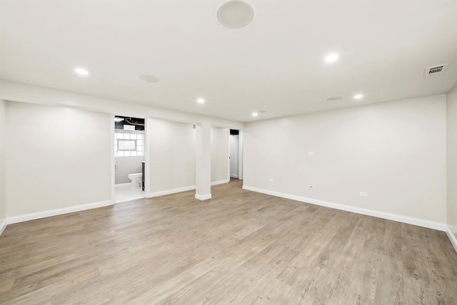 basement featuring light hardwood / wood-style flooring