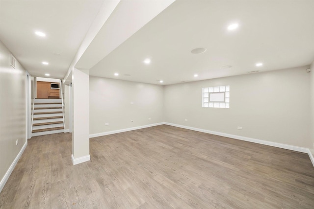 basement featuring light hardwood / wood-style flooring