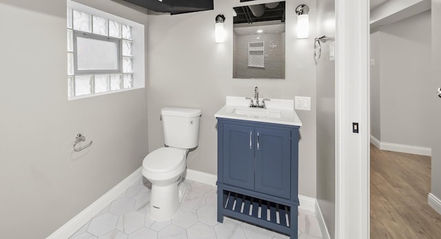 bathroom with tile patterned floors, vanity, and toilet