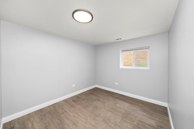 empty room featuring wood-type flooring