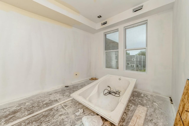 bathroom featuring a washtub