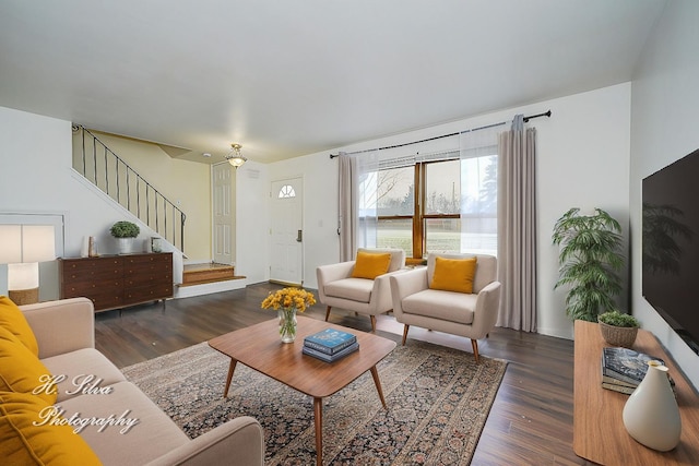 living room with dark hardwood / wood-style flooring