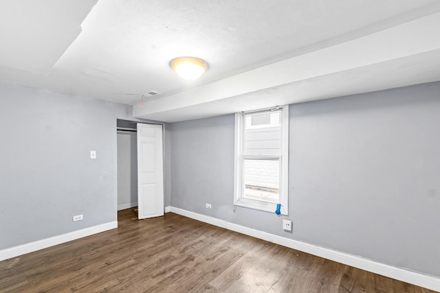 unfurnished bedroom featuring wood-type flooring