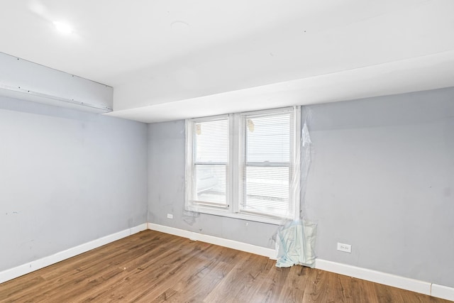 spare room with hardwood / wood-style floors