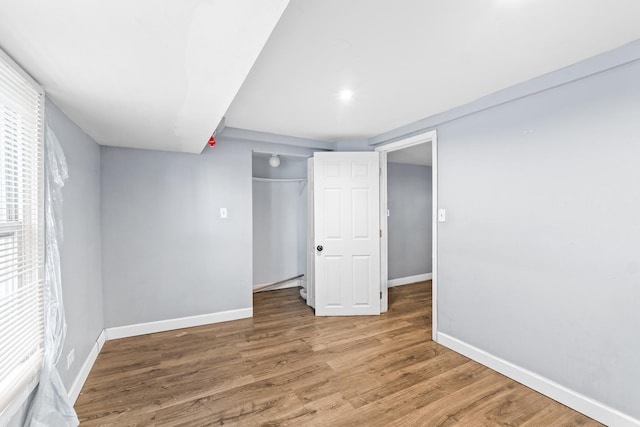 interior space featuring hardwood / wood-style flooring and a closet