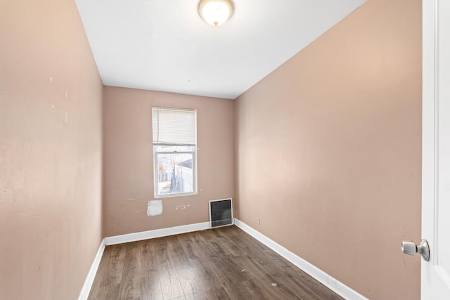 empty room with dark hardwood / wood-style floors