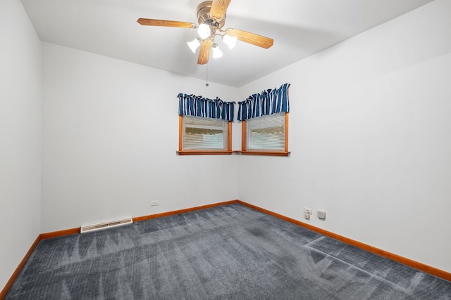 carpeted spare room with ceiling fan