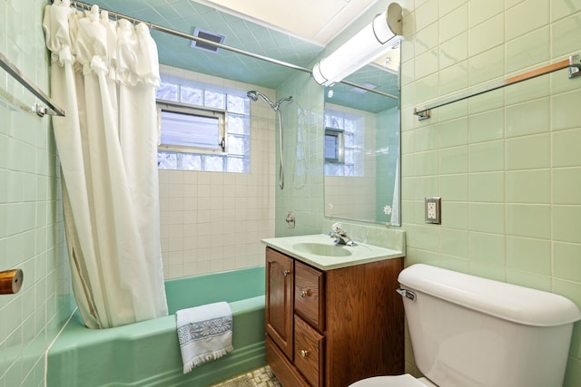 full bathroom with vanity, shower / bath combination with curtain, and toilet