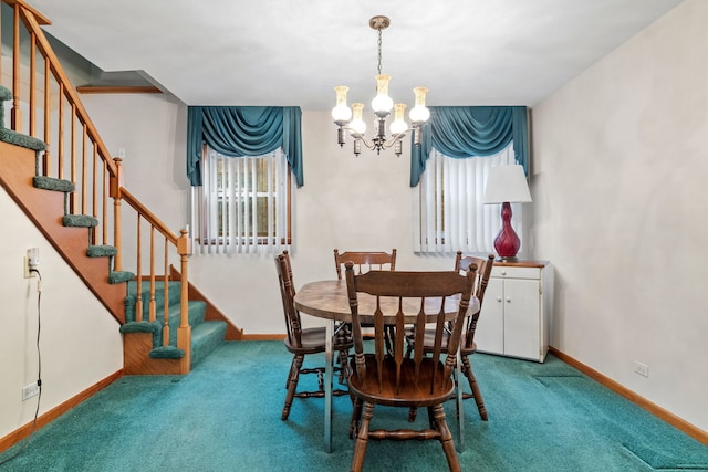 carpeted dining room featuring a chandelier