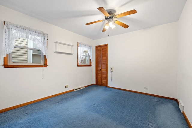 carpeted empty room with ceiling fan