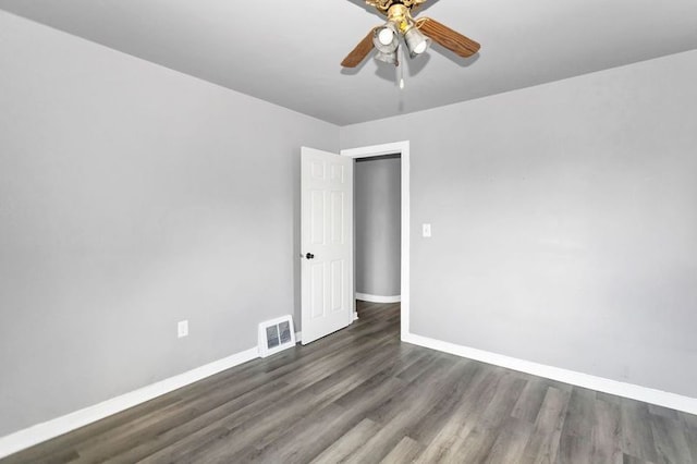 unfurnished room featuring dark hardwood / wood-style flooring and ceiling fan