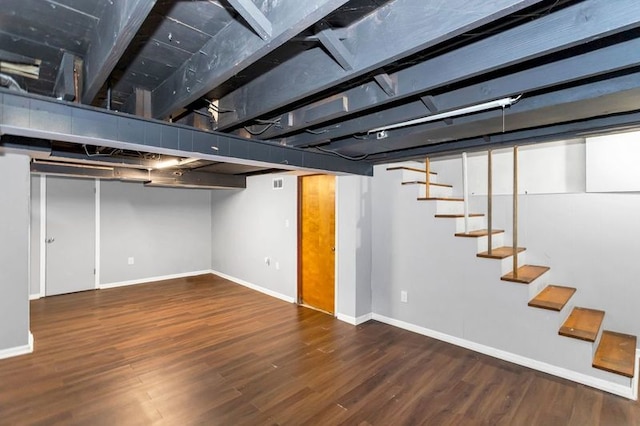 basement featuring dark hardwood / wood-style floors